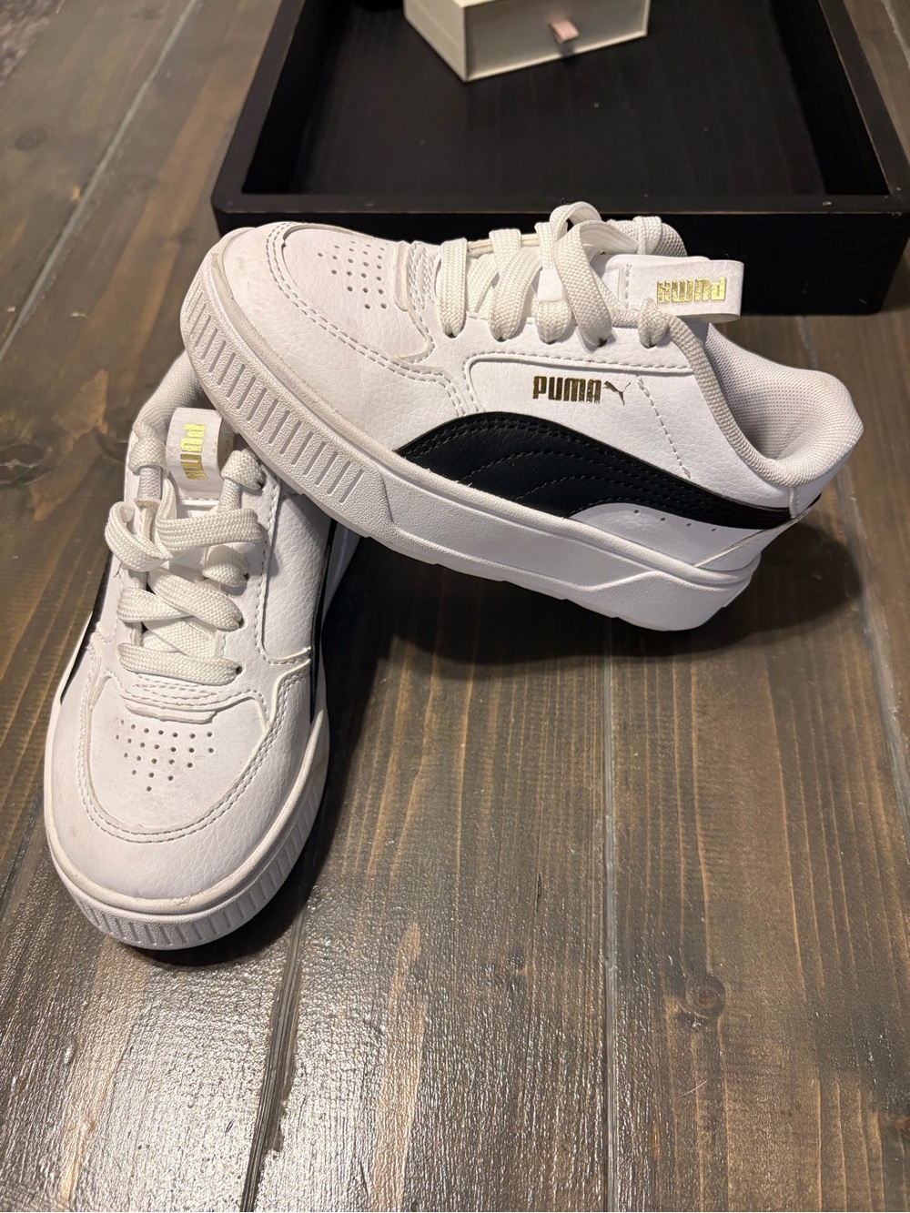 Puma Kids White Sneakers with Black Stripe and Gold Accents